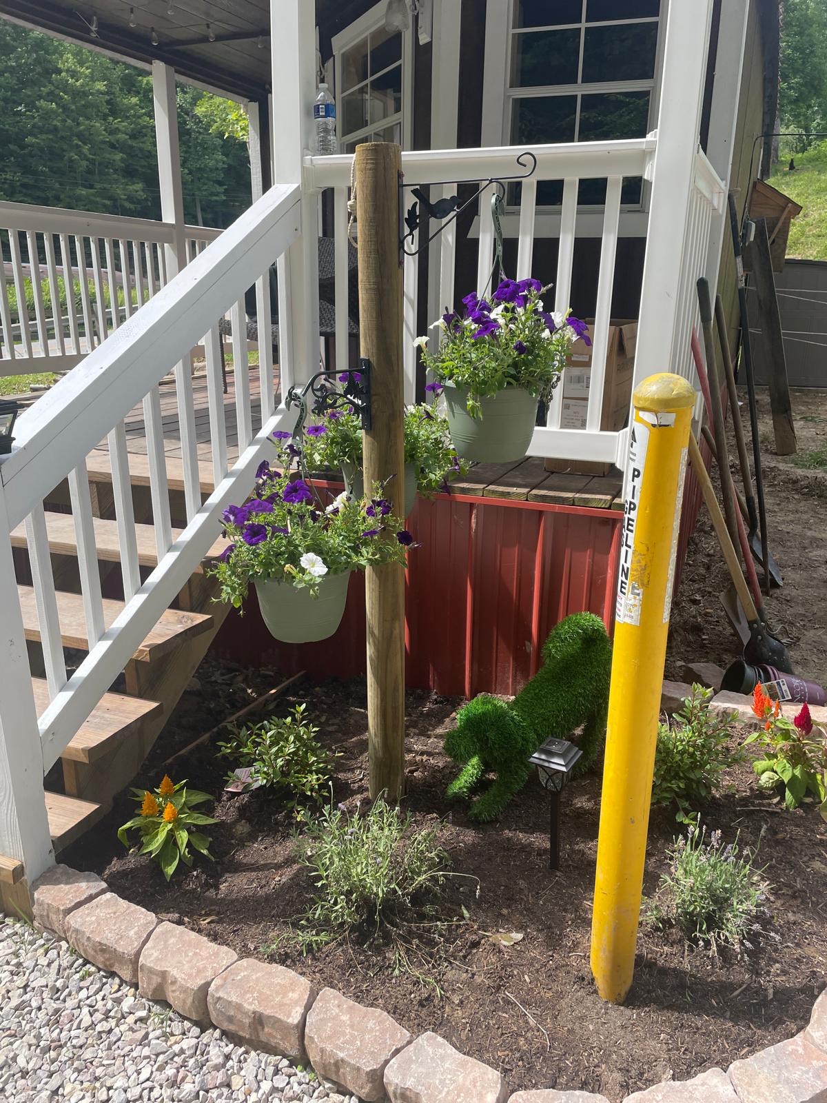 Flower beds and steps up to the porch